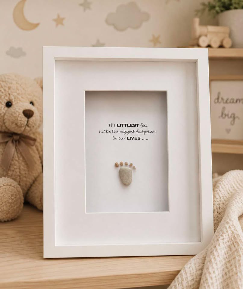 The Littlest Feet pebble art footprint in white frame